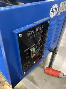 Control panel on a Nilfisk DTE wall-mounted static pressure washer before contactor and overload replacement repair.